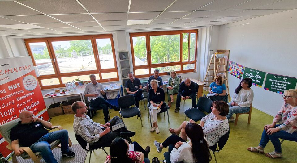 „Fachgespräch im Fischglas“ – Geflüchtete integrieren