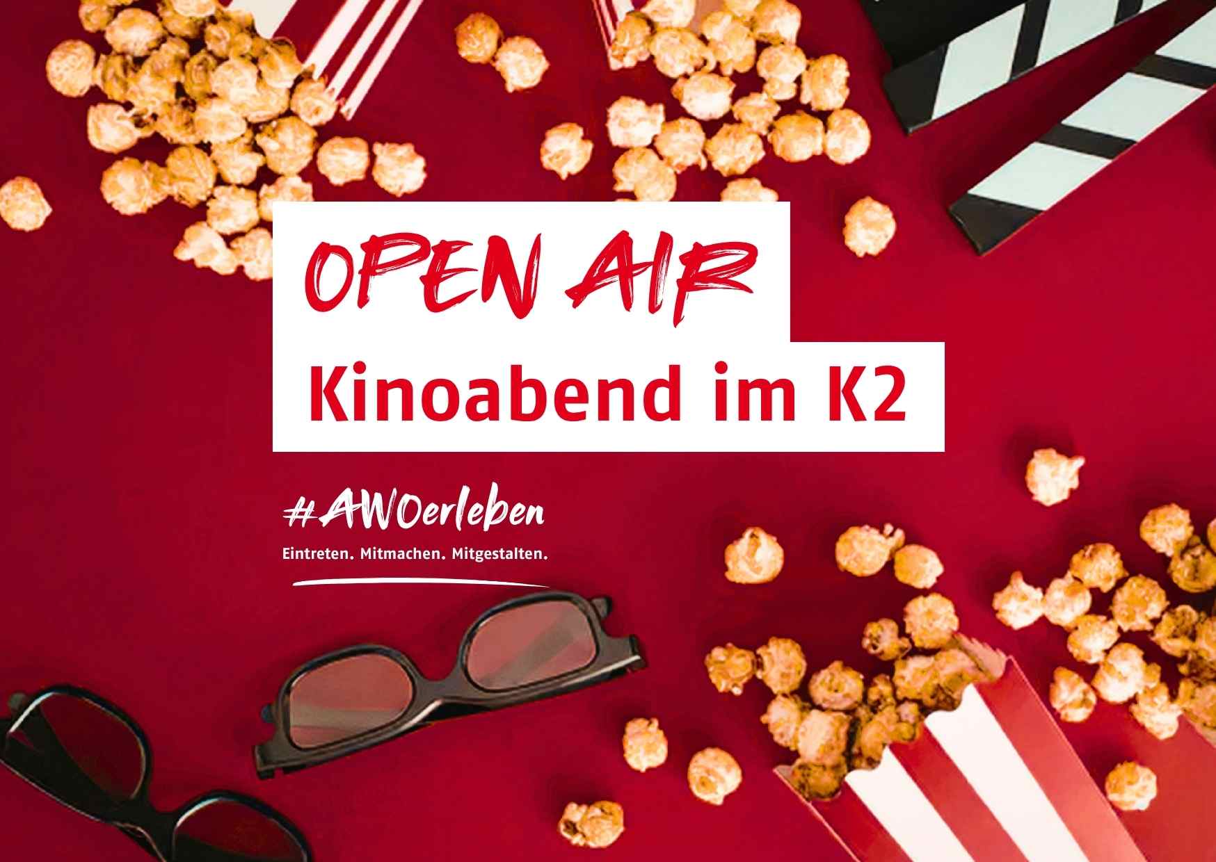 Auf einem Roten Teppich liegt Popcorn, Kindo 3D Brillen und eine Szene Klappe